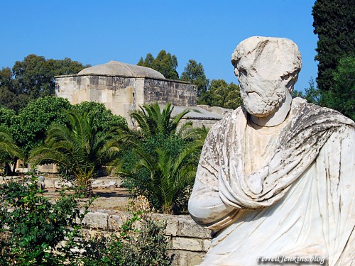 The back of the basilica of Titus at Gortyna, Crete. Roman statue in foreground. Photo by Ferrell Jenkins. 