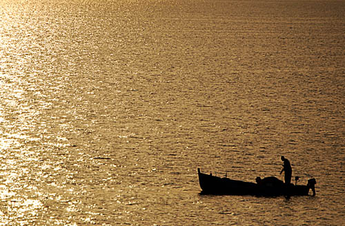 A fisherman on the Sea of Galilee at sunrise. Photo by Ferrell Jenkins.
