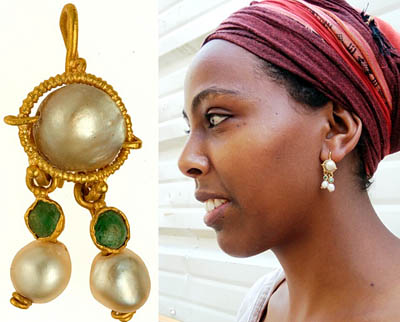 The earring and a model displaying it. IAA Photos.