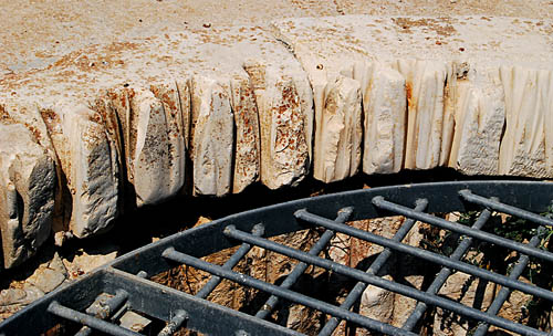 Grooves cut in the well curb. Photo by Ferrell Jenkins.