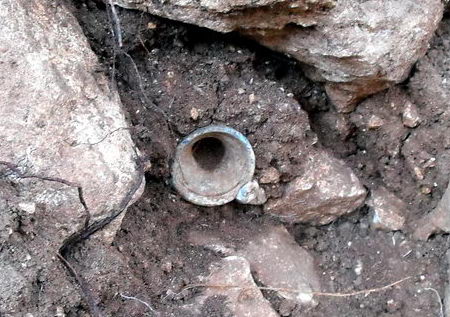 Glass bottle found in a wall at Khirbet Qeiyafa by Royce Chandler. Photo: Luke Chandler.