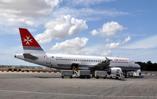 Air Malta planes display the Maltese Cross. Photo by Ferrell Jenkin in Malta.