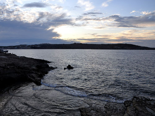 The rugged coast of St. Paul's Bay at Sunset. Photo by Ferrell Jenkins.