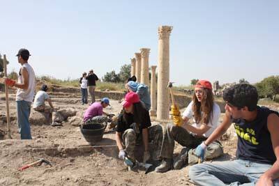 Students from the International Academy in Amman work at Um Qais. Photo by Taylor Luck, Jordan Times.