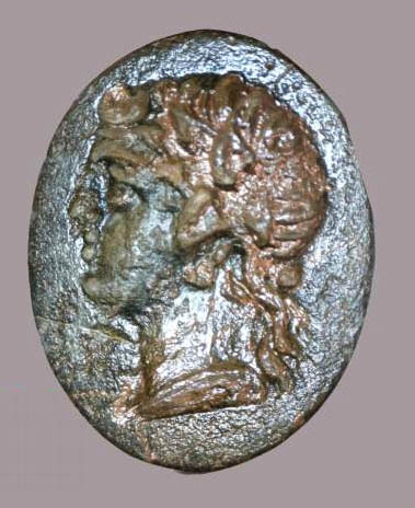 Bronze signet ring with portrait of Apollo (Microscope photo adapted by Paula Weimann Barak, courtesy of the Tel Dor Expedition.