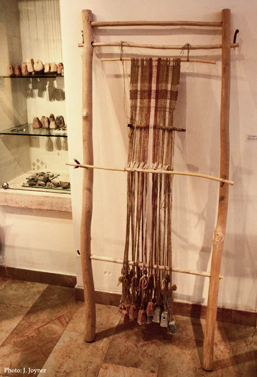 Weaving Loom with weights from Yodefat. Hecht Museum, Haifa. Photo by J. Joyner.
