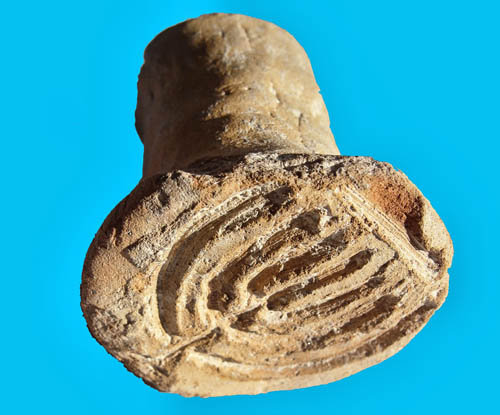 Bread stamp discovered at Acco. Photo: Dr. Danny Syon, courtesy IAA.