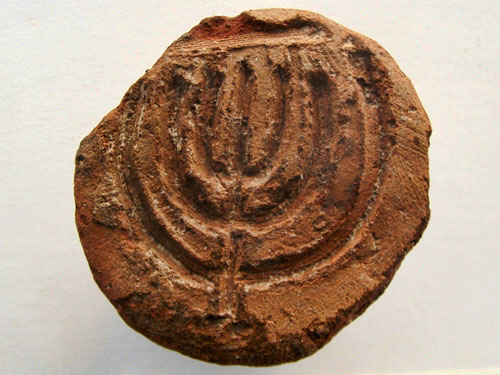Bread stamp discovered at Acco. Photo: Dr. Danny Syon, courtesy IAA.