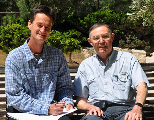 Bill Schlegel autographs a copy of The Satellite Bible Atlas for Ferrell Jenkins.