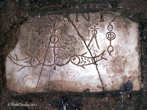 Marker in one of the catacombs. Note symbols of anchor and fish. Photo by Ferrell Jenkins, 1973.