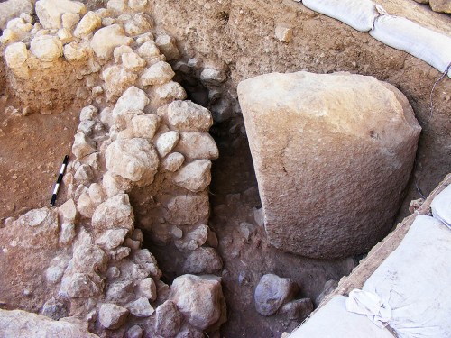 A Chalcolithic period building and the standing stone (massebah) positioned at the end of it. Photo: Assaf Peretz, courtesy IAA.
