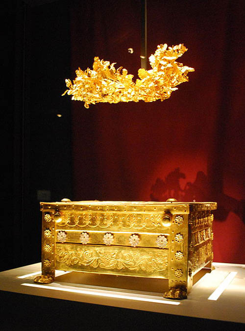 Golden wreath suspended over a golden larnax. Photo by Sarah Murray.