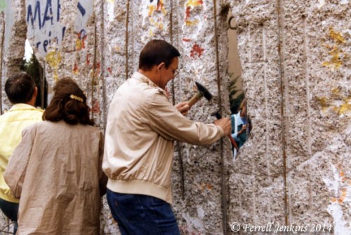 Trying to chisel a piece of the Berlin Wall in 1990.