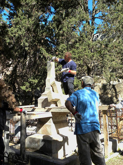 Restoring damaged tomb stones in the Protestant Cemetery.