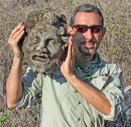 Dr. Michael Eisenberg, University of Haifa, holding the Pan mask discovered at Hippos-Sussita.