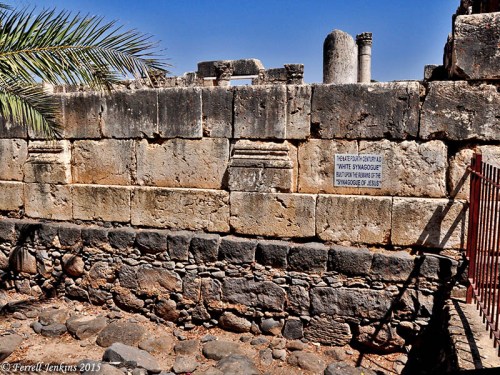 The black basalt foundation is visible under the white limestone building. Photo by Ferrell Jenkins.