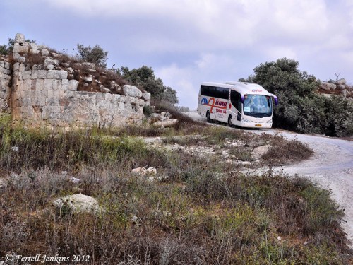 Tourist bus leaving Samaria by the old Roman street. Photo by Ferrell Jenkins.