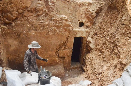 The entrance to the cave when discovered during an inspection by the Israel Antiquities Authority, prior to the construction of a neighborhood nursery school. Photo by Shai Halevy, courtesy of the IAA.