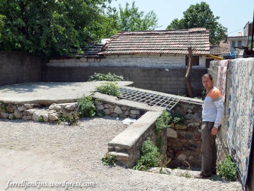 Guide waiting to take us into ruins of the Dormitian church. Photo by Ferrell Jenkins.