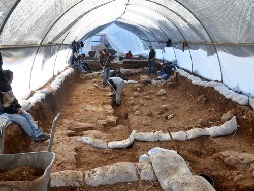 The excavation site in the Russian Compound. One can see the sling stones on the floor, which are tangible evidence of the battle that was waged here 2,000 years ago. Photographic credit: Yoli Shwartz, courtesy of the Israel Antiquities Authority.