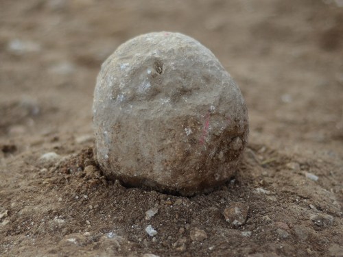 The excavation site in the Russian Compound. One can see the sling stones on the floor, which are tangible evidence of the battle that was waged here 2,000 years ago. Photographic credit: Yoli Shwartz, courtesy of the Israel Antiquities Authority.