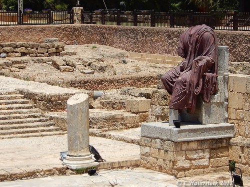 A headless porphyry statue thought to be that of Emperor Hadrian displayed at Caesarea Maritima. Photo by Larry Haverstock.
