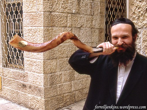 Shofar sounded by a shopkeeper in the Jewish Quarter, Jerusalem. Photo by Ferrell Jenkins 1993.