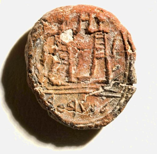 Seal impression showing two men and bearing the inscription "governon of the city." IAA photo by Clara Amit.