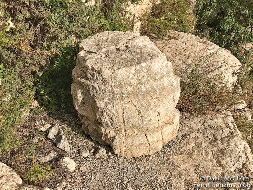 A carved stone piece that looks like the base of a column. Photo by David McClister.